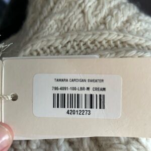 Beautiful brand new down cardigan.  It’s a medium but runs big.